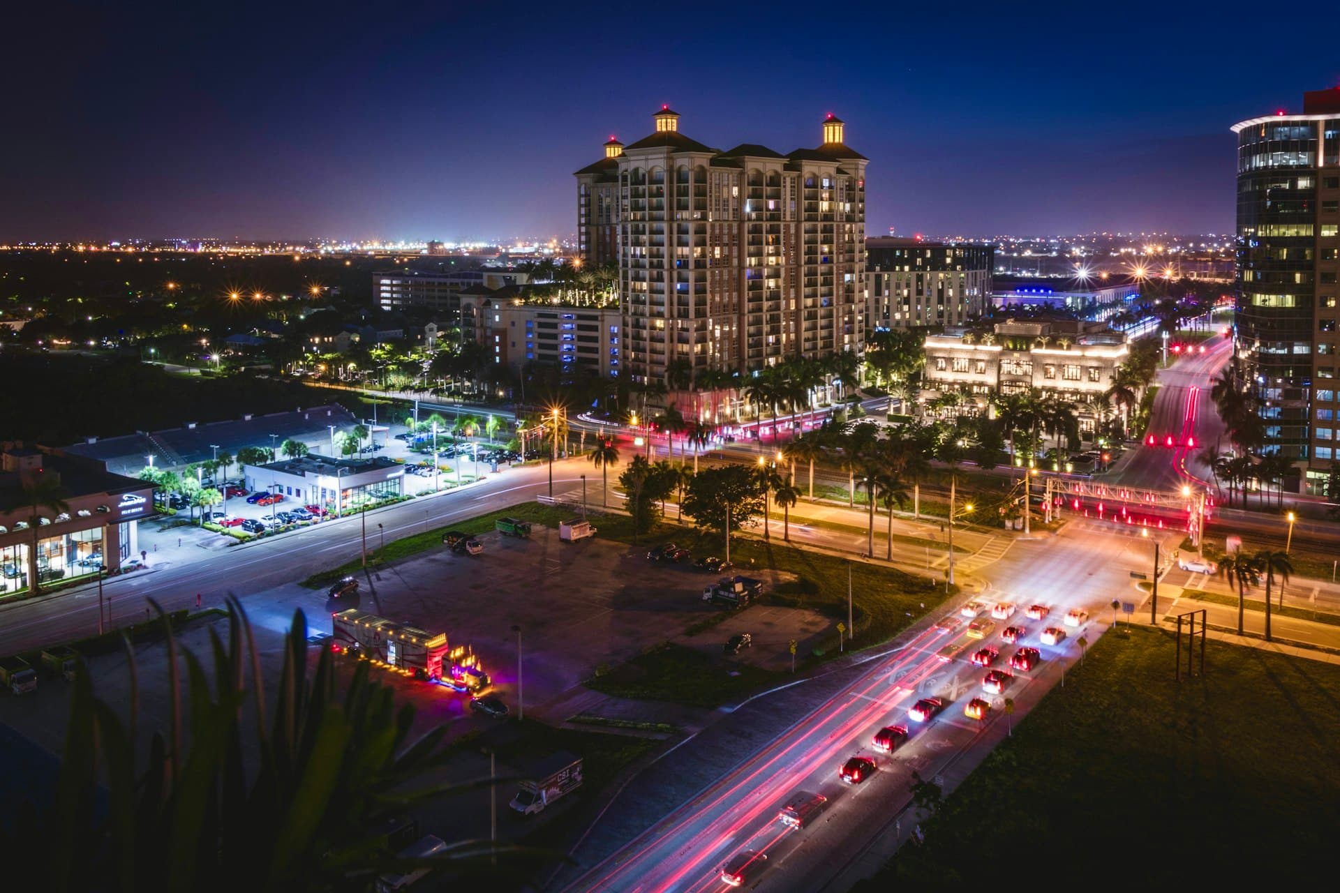 Aerial night view of downtown West Palm Beach skyline and waterway